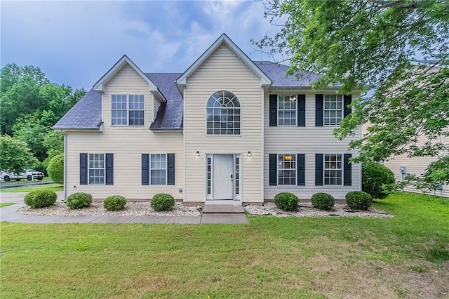 6181 E Fayetteville Dr, Riverdale, GA 30296 - view of front of home with a front yard and a shingled roof