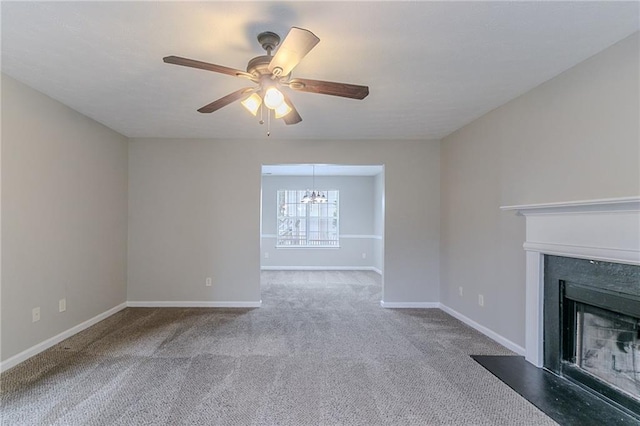 6181 E Fayetteville Dr, Riverdale, GA 30296 - unfurnished living room featuring a premium fireplace, carpet floors, a ceiling fan, and a chandelier