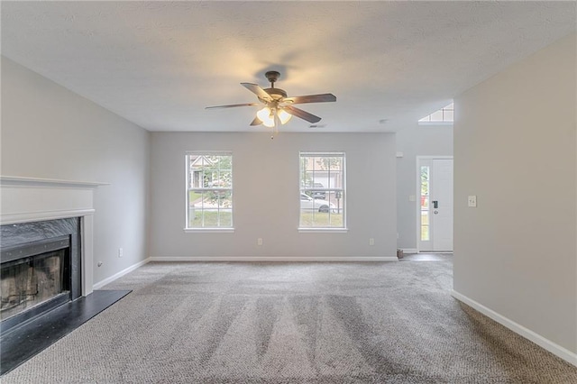 6181 E Fayetteville Dr, Riverdale, GA 30296 - unfurnished living room with carpet floors, a fireplace, a ceiling fan, and a textured ceiling