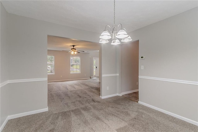 6181 E Fayetteville Dr, Riverdale, GA 30296 - empty room featuring carpet, a chandelier, and ceiling fan