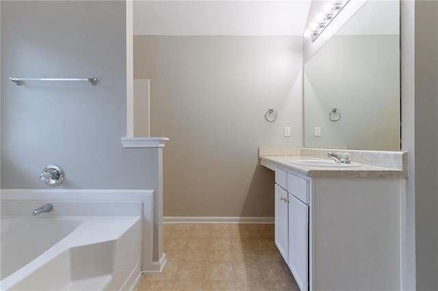 6181 E Fayetteville Dr, Riverdale, GA 30296 - bathroom with vanity and a garden tub
