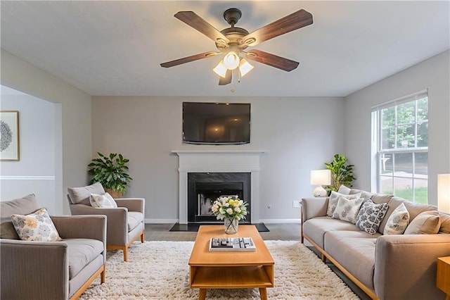 6181 E Fayetteville Dr, Riverdale, GA 30296 - living area with ceiling fan, a premium fireplace, and wood finished floors