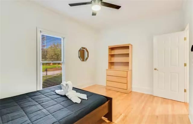 bedroom featuring ceiling fan and wood finished floors