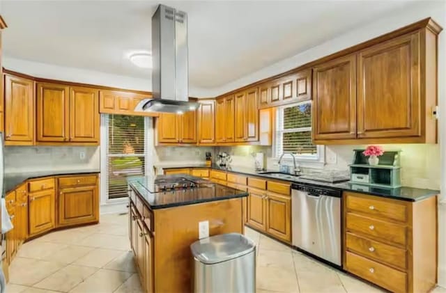 kitchen with brown cabinetry, cooktop, dishwasher, and island range hood