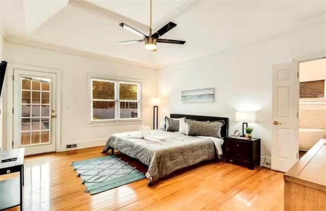 bedroom with baseboards, a ceiling fan, visible vents, and light wood-style floors