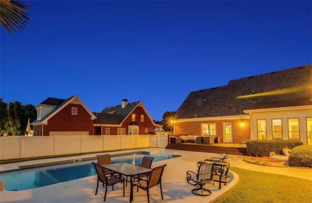 view of pool with a fenced backyard, outdoor lounge area, a fenced in pool, and a patio