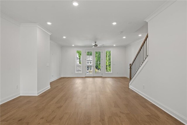 carpeted bedroom featuring a tray ceiling, visible vents, crown molding, baseboards, and ensuite bathroom