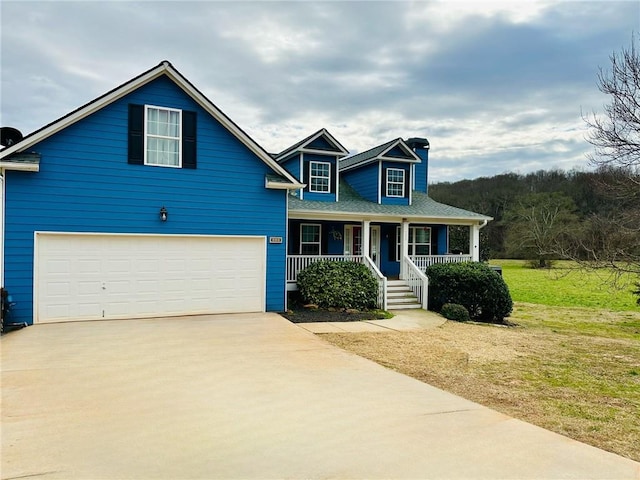 view of front of property featuring a garage, covered porch, and a front lawn