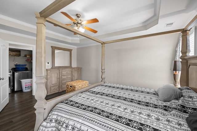 bedroom with decorative columns, dark hardwood / wood-style flooring, ornamental molding, ceiling fan, and independent washer and dryer