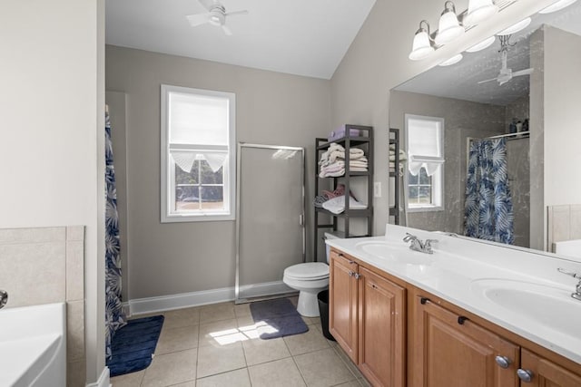 full bathroom with tile patterned floors, toilet, vaulted ceiling, vanity, and ceiling fan