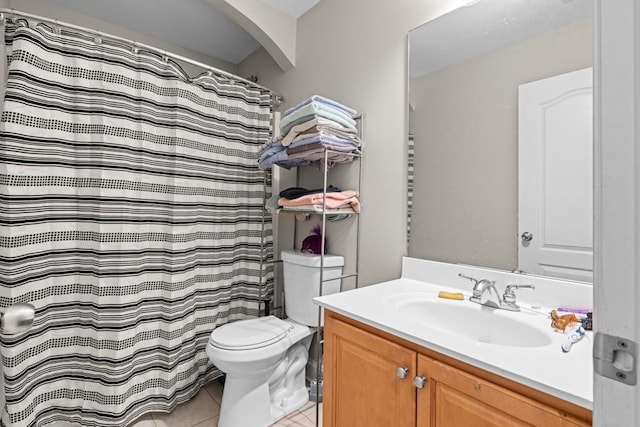 bathroom featuring vanity, tile patterned floors, toilet, and a shower with shower curtain