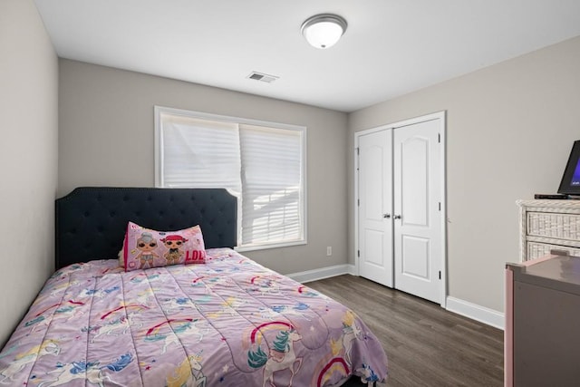 bedroom featuring dark hardwood / wood-style flooring and a closet