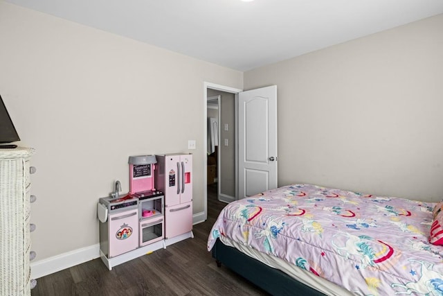 bedroom featuring dark hardwood / wood-style flooring