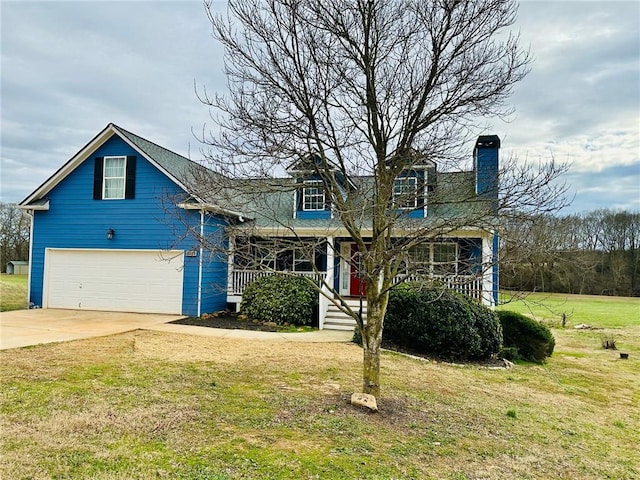 view of front of house featuring a porch, a garage, and a front yard