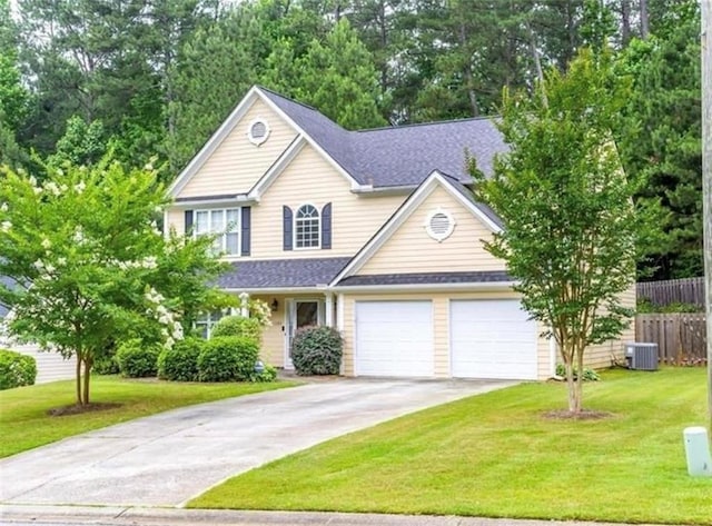 view of front facade with a garage, central AC, and a front lawn