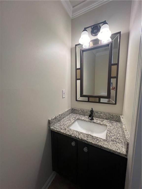 bathroom featuring vanity and crown molding