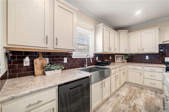 kitchen featuring tasteful backsplash, light wood finished floors, dishwasher, ornamental molding, and a sink