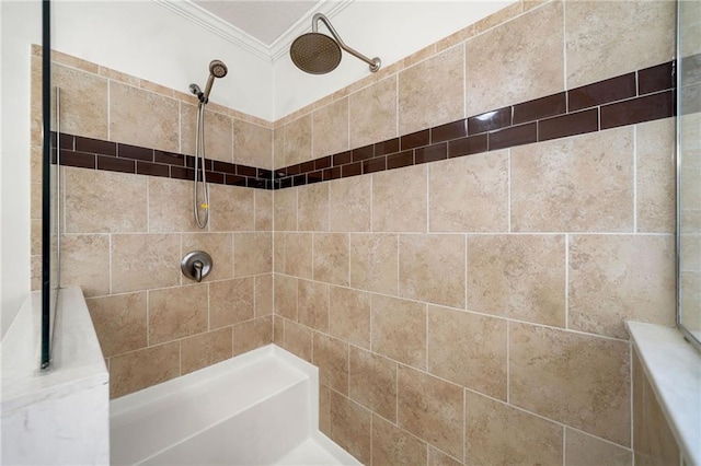 bathroom with crown molding and tiled shower