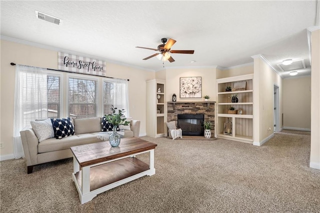 carpeted living room with visible vents, a textured ceiling, ceiling fan, and ornamental molding