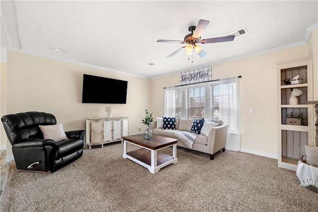 living room featuring visible vents, ceiling fan, crown molding, and carpet