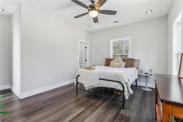 bedroom featuring ceiling fan and dark wood-type flooring