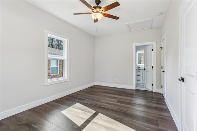 unfurnished room with ceiling fan and dark hardwood / wood-style floors