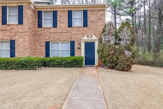 view of front of house featuring brick siding