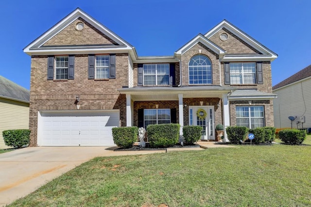 view of front facade featuring a front yard and a garage