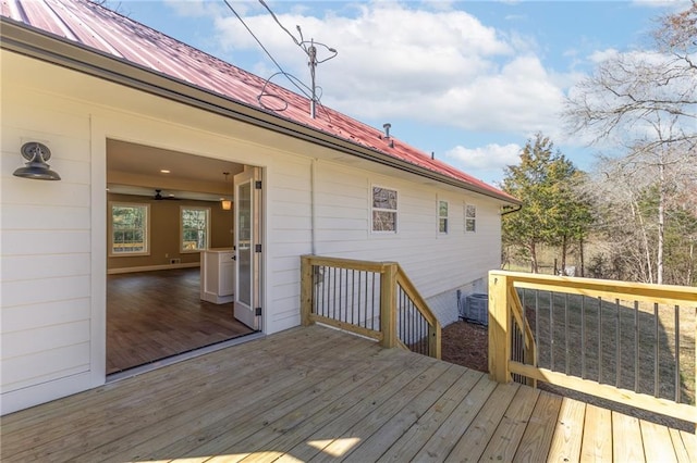 wooden terrace with a ceiling fan