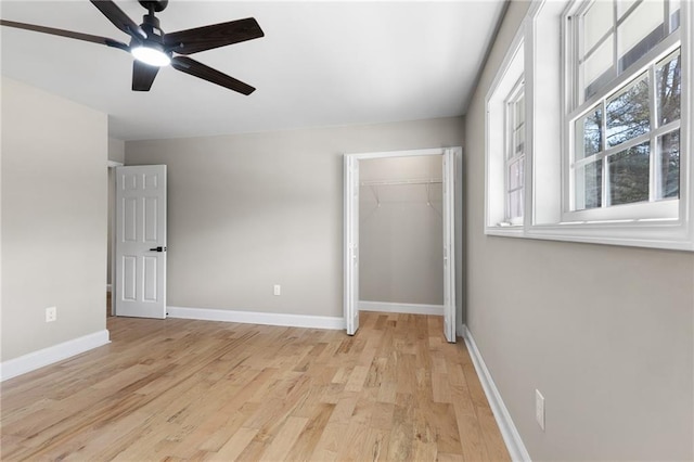 unfurnished bedroom featuring light wood-type flooring and baseboards