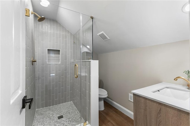 full bath featuring vaulted ceiling, visible vents, a shower stall, and toilet