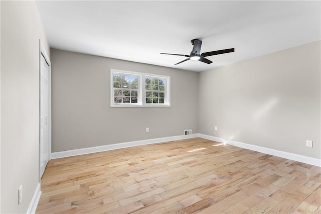 unfurnished bedroom with ceiling fan, visible vents, baseboards, a closet, and light wood-type flooring