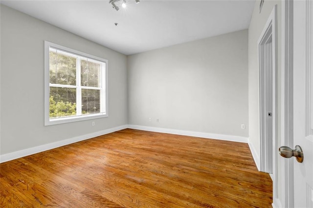 502 SW Pryor St SW Unit 325, Atlanta, GA 30312 - empty room with baseboards and wood finished floors