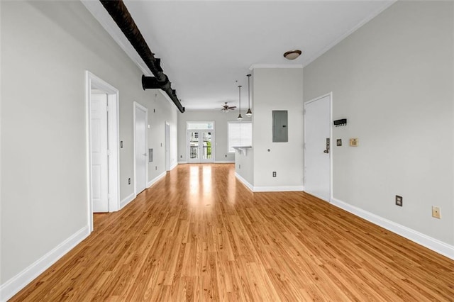 502 SW Pryor St SW Unit 325, Atlanta, GA 30312 - unfurnished living room featuring electric panel, a ceiling fan, light wood-style floors, baseboards, and crown molding