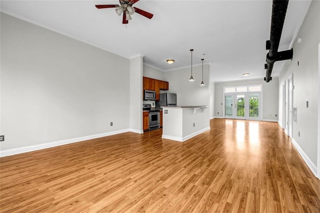 502 SW Pryor St SW Unit 325, Atlanta, GA 30312 - unfurnished living room with a ceiling fan, light wood-style flooring, baseboards, and crown molding