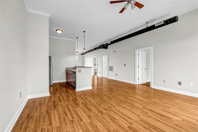 502 SW Pryor St SW Unit 325, Atlanta, GA 30312 - unfurnished living room featuring ceiling fan, light wood finished floors, crown molding, and baseboards