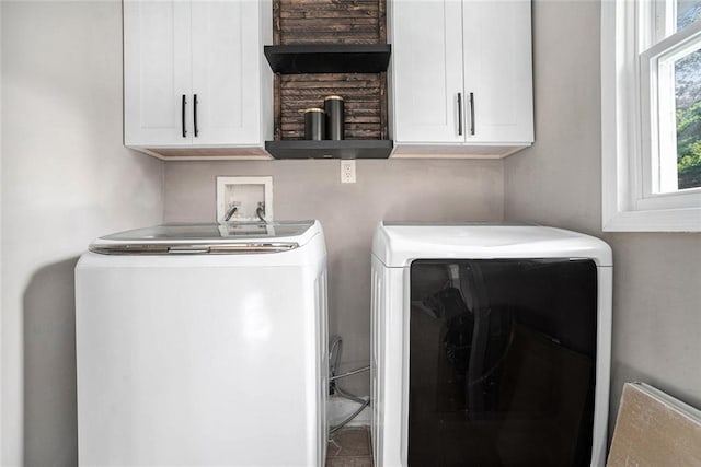 laundry room featuring washer and dryer and cabinet space