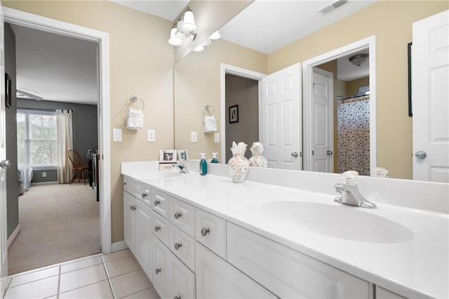 bathroom with tile patterned flooring and vanity