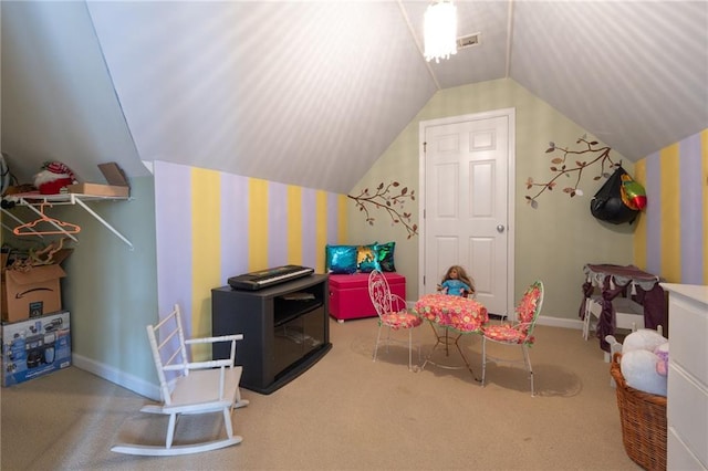 rec room featuring carpet and vaulted ceiling