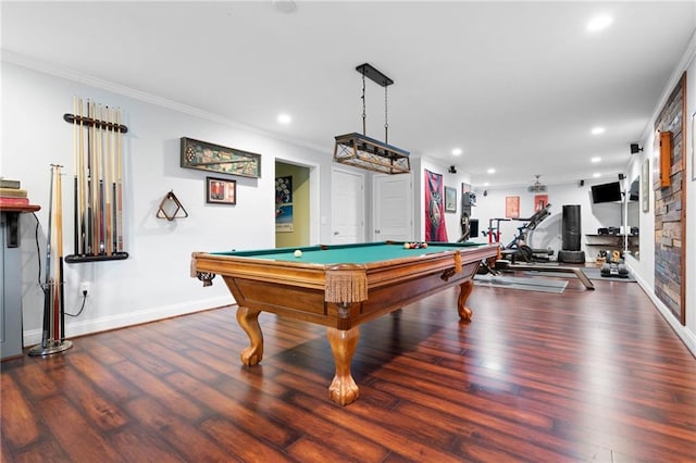 rec room featuring ornamental molding, dark wood-type flooring, and billiards