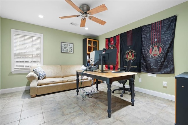 office space featuring ceiling fan and light tile patterned floors