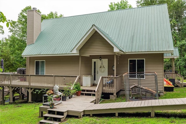 1182 Cedar Rd, Lincolnton, GA 30817 - rear view of property with a chimney, metal roof, and a deck