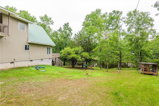 1182 Cedar Rd, Lincolnton, GA 30817 - view of green lawn with stairway, view of wooded area, and a wooden deck