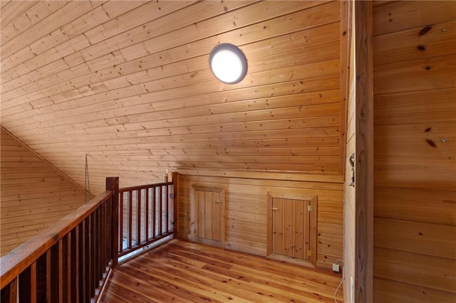 1182 Cedar Rd, Lincolnton, GA 30817 - corridor with wood walls, light wood finished floors, and an upstairs landing