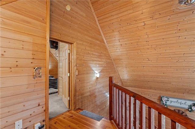 1182 Cedar Rd, Lincolnton, GA 30817 - hall with an upstairs landing, wooden walls, vaulted ceiling, wood ceiling, and light wood-style floors