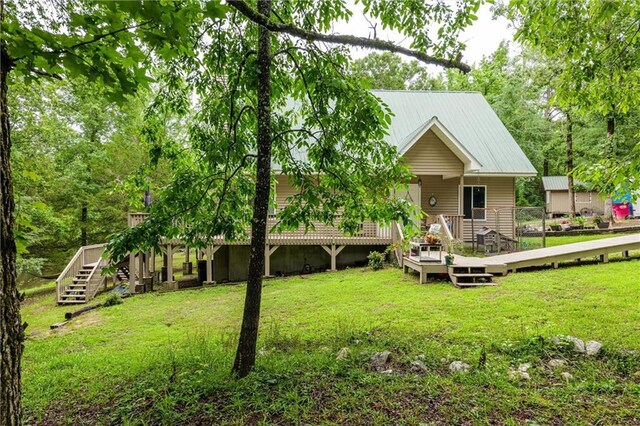 1182 Cedar Rd, Lincolnton, GA 30817 - back of house with a deck, stairs, a lawn, and metal roof