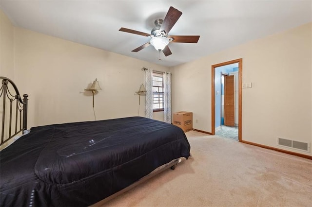 bedroom featuring ceiling fan and light carpet