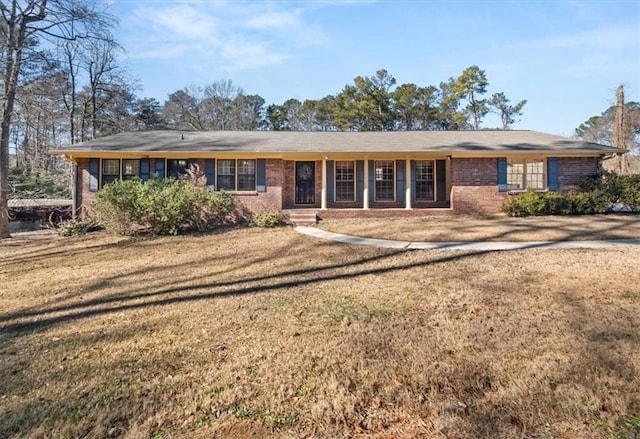 ranch-style house with a front lawn