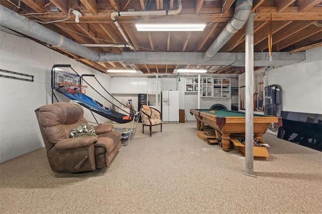 basement with white refrigerator with ice dispenser and billiards