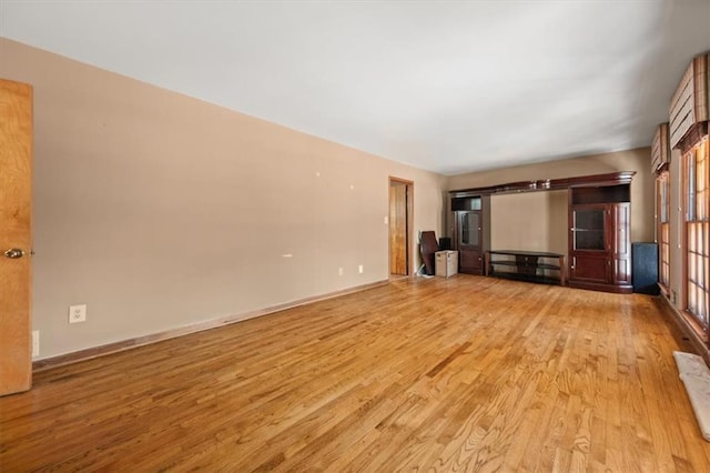 unfurnished living room with light hardwood / wood-style floors